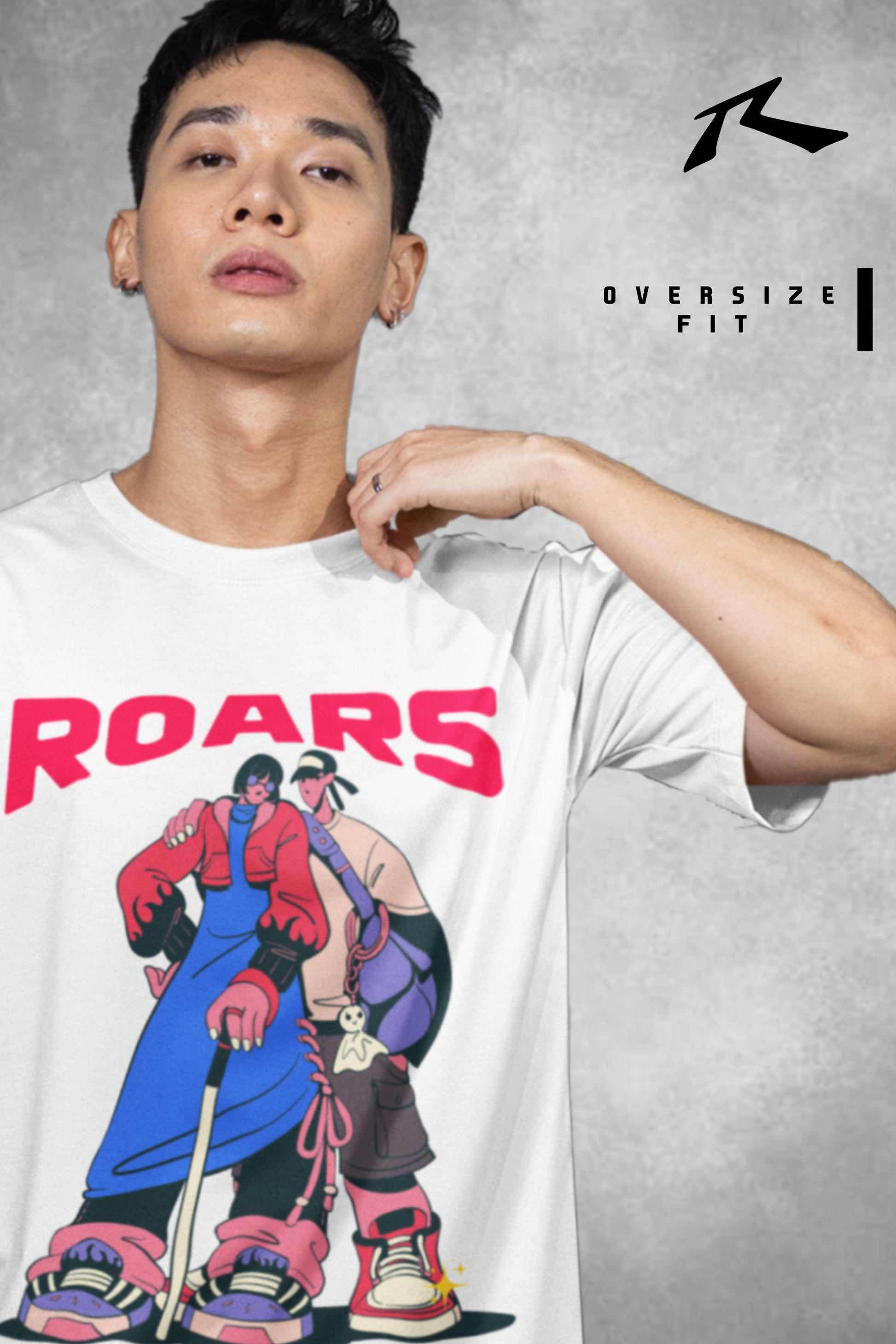 Person wearing a white t-shirt with colorful graphic design and 'ROARS' text, brand logo visible.