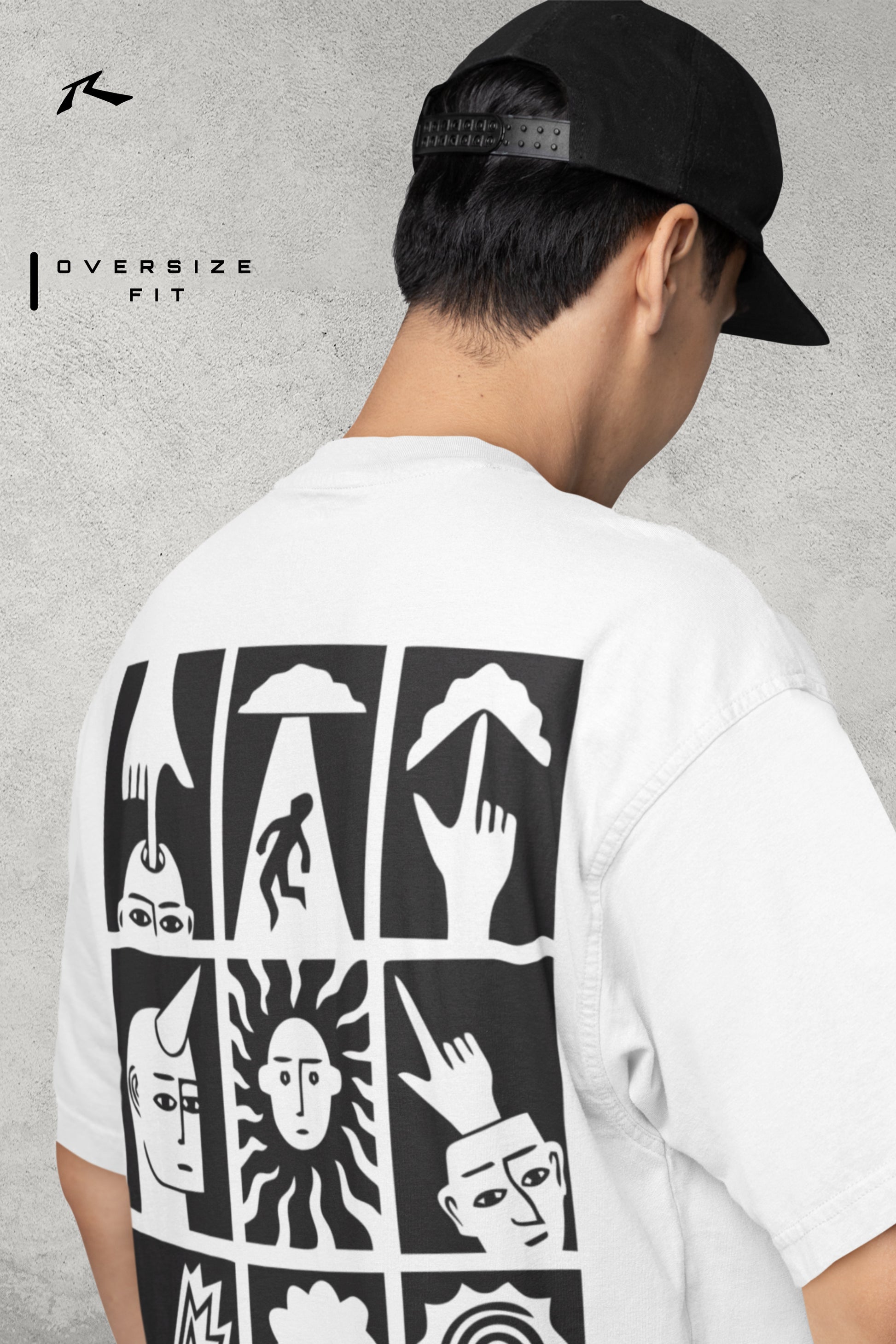 Person wearing a white t-shirt with black graphic designs on the back, standing against a gray background.