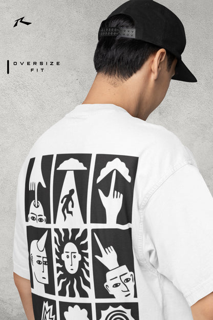 Person wearing a white t-shirt with black graphic designs on the back, standing against a gray background.