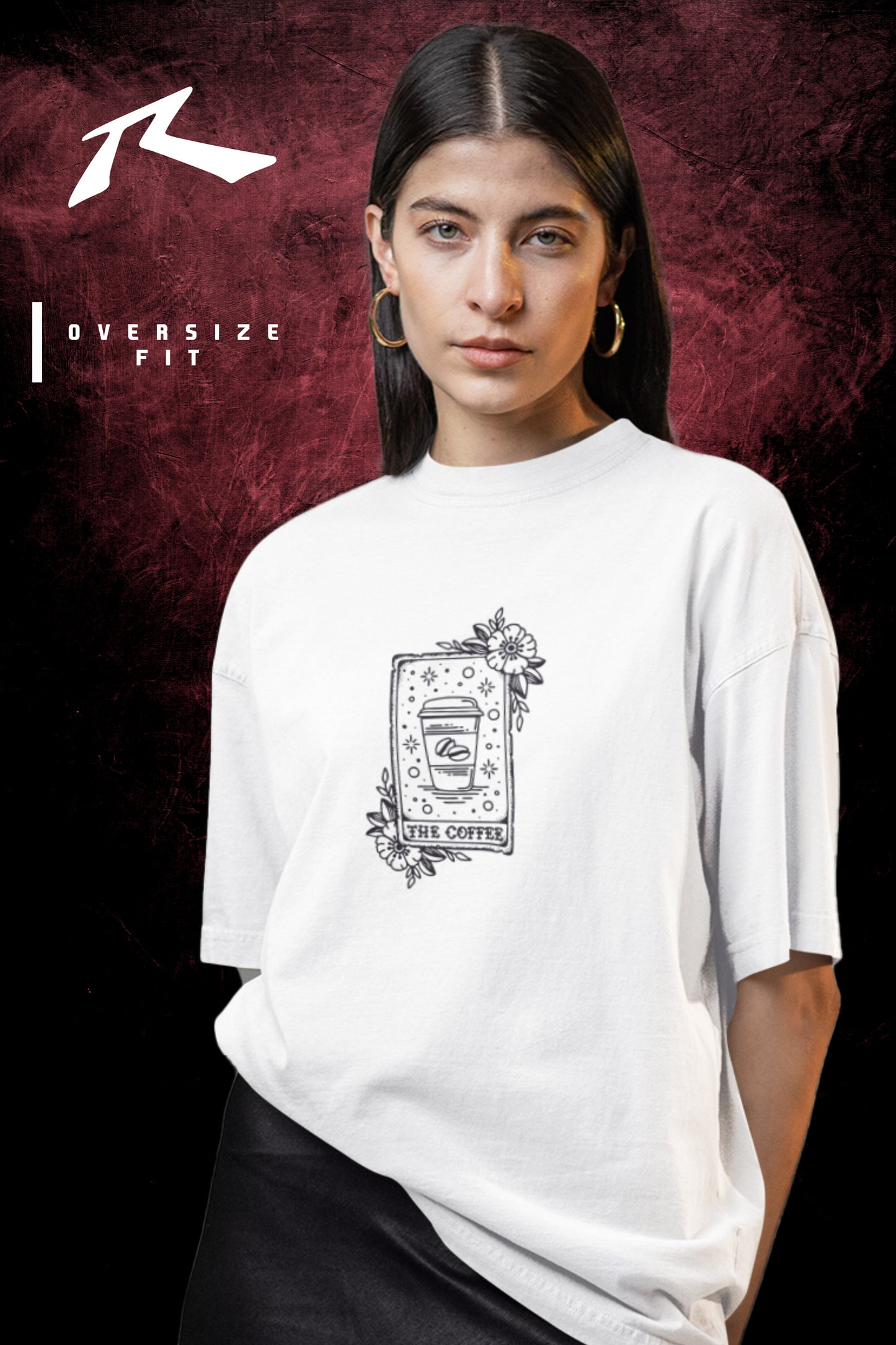 Person wearing an oversized white t-shirt with a graphic design on a dark background