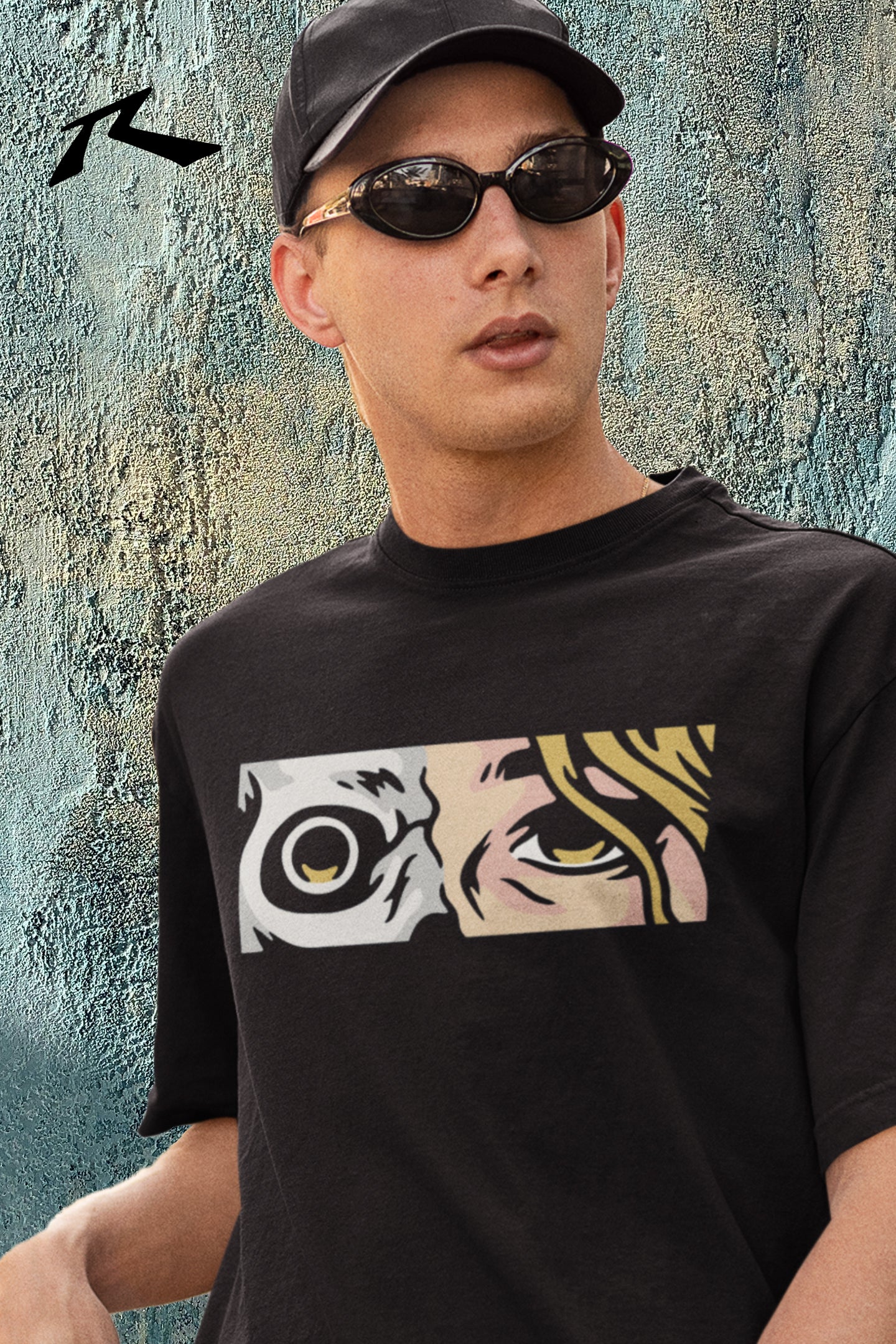 Person wearing a black t-shirt with a graphic design, standing against a textured wall.